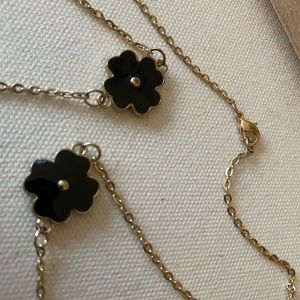 Beautiful metal necklace with black metal flowers
